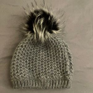 Grey knit hat with black & white pompom